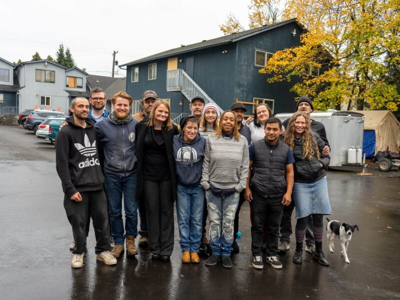 Group of homeless and volunteers