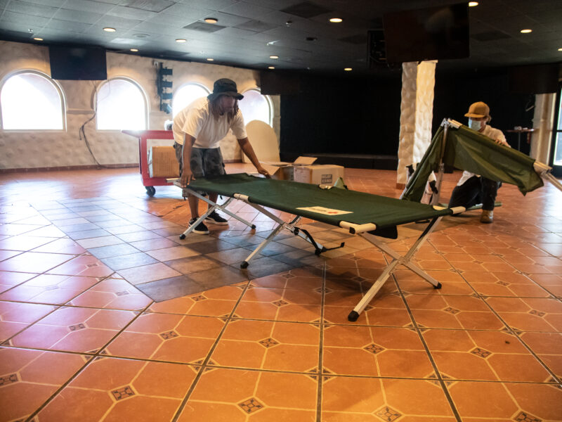 Workers setting up sleeping area