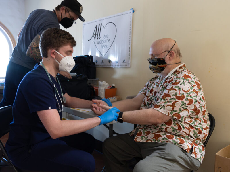 Healthcare working checking patient