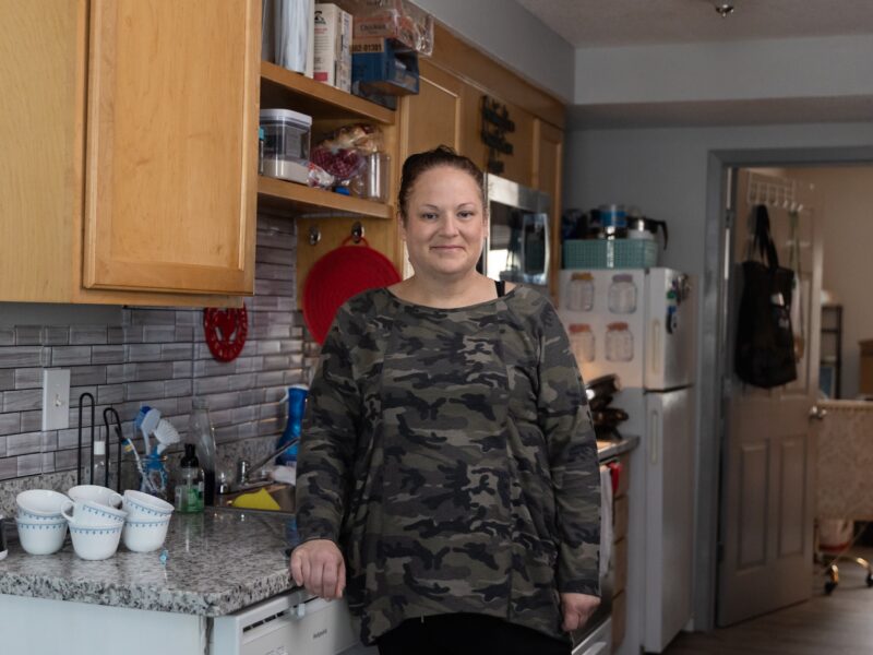 Woman stands in a kitchen