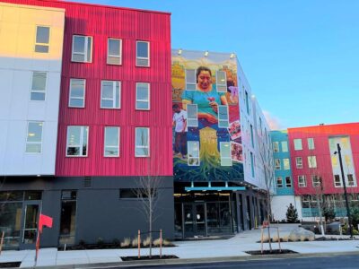 Las Adelitas apartment building - image shows the mural on the side of the building