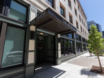 Street-level view of the entrance to The Joyce Apartments