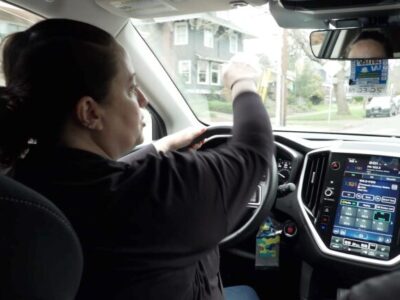 Adele - outreach worker, driving her car