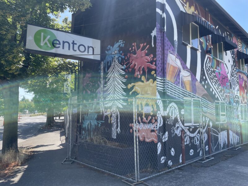 Exterior of the Kenton motel, including a colorful mural and a sign that says