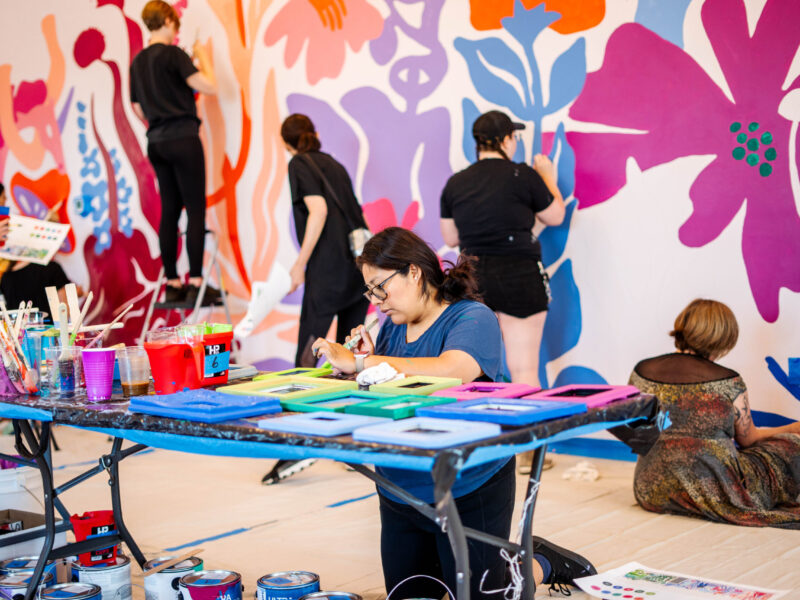 Image of person doing arts and crafts on a table.